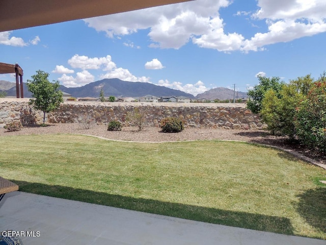 7876 Enchanted Path Dr, El Paso, TX 79911 - view of green lawn with a mountain view and a patio area