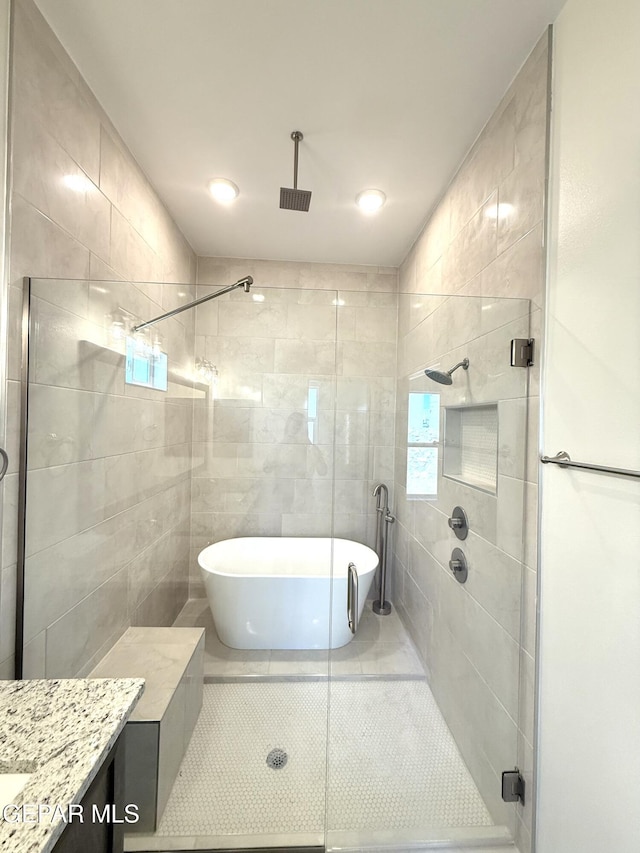 3872 Surmise St, El Paso, TX 79938 - bathroom with a stall shower, a freestanding tub, vanity, and tile patterned flooring