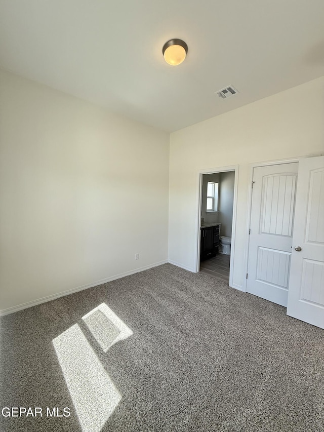 3872 Surmise St, El Paso, TX 79938 - unfurnished bedroom with ensuite bath, visible vents, baseboards, and carpet