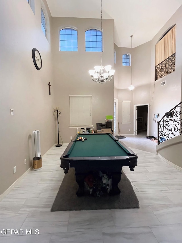 playroom with pool table, an inviting chandelier, and a healthy amount of sunlight