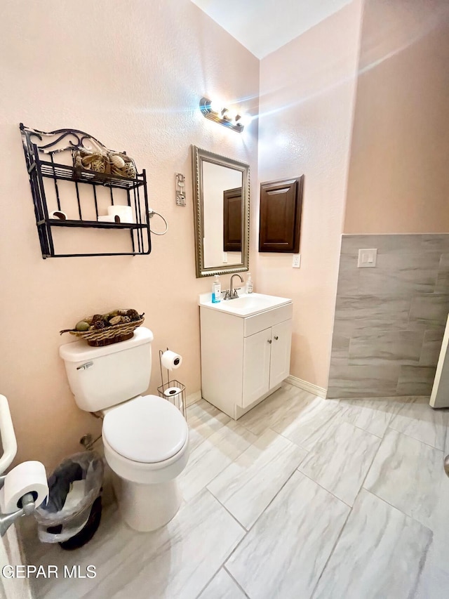 3165 Destiny Point Dr, El Paso, TX 79938 - bathroom with toilet, marble finish floor, and vanity