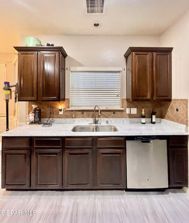 3165 Destiny Point Dr, El Paso, TX 79938 - kitchen featuring dark brown cabinets, visible vents, decorative backsplash, dishwasher, and a sink