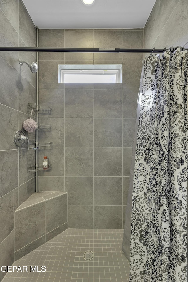 bathroom featuring walk in shower