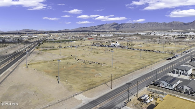 birds eye view of property featuring a mountain view