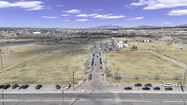 birds eye view of property with a rural view and a mountain view