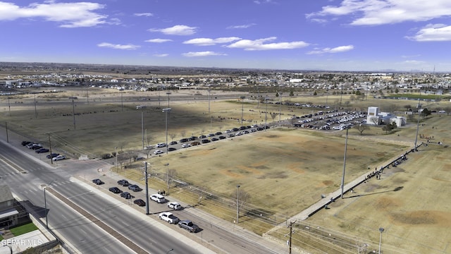 birds eye view of property with a rural view