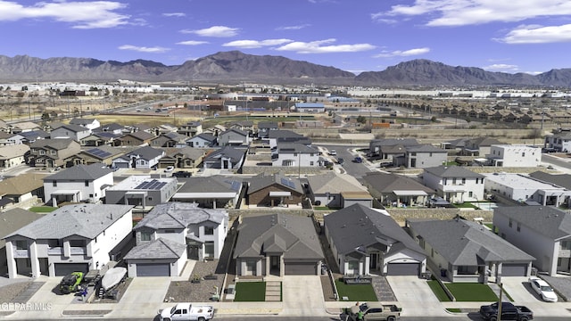 birds eye view of property featuring a mountain view