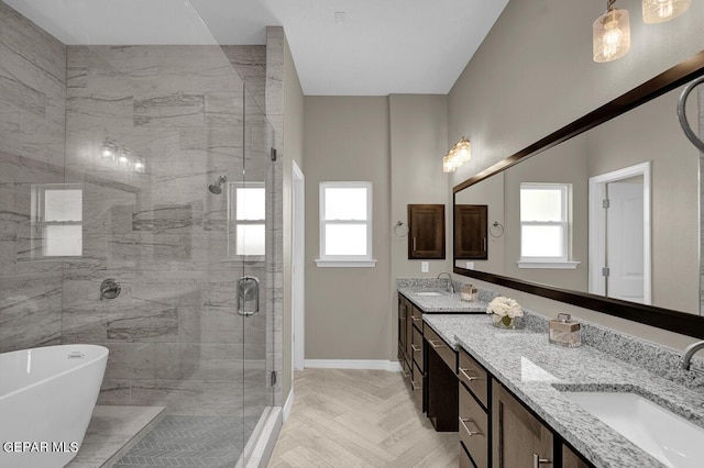 bathroom with separate shower and tub and vanity