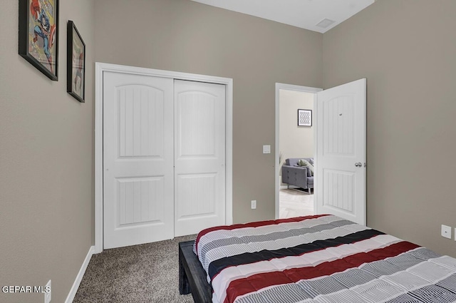 carpeted bedroom with a closet
