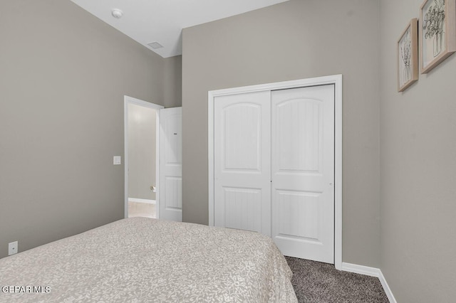 carpeted bedroom featuring a closet