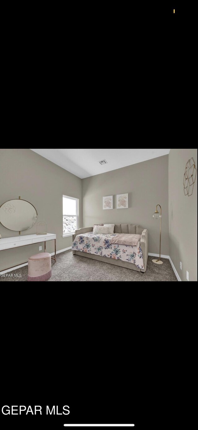 bedroom with carpet flooring, baseboards, and visible vents