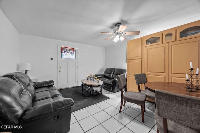 tiled living room featuring ceiling fan