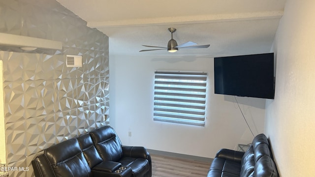 living room with hardwood / wood-style flooring and ceiling fan