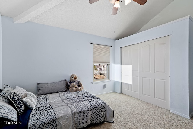 bedroom with light colored carpet, lofted ceiling with beams, ceiling fan, a textured ceiling, and baseboards