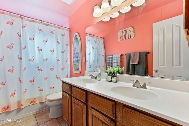 bathroom with shower / tub combo with curtain, tile patterned flooring, a sink, and toilet