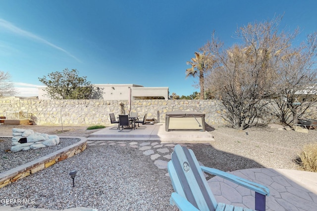 view of yard featuring fence and a patio