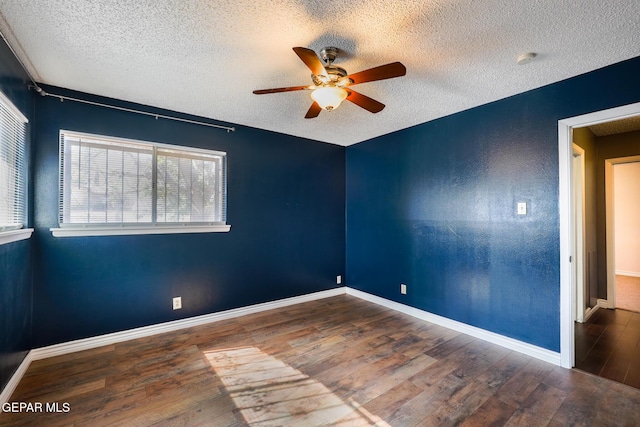 unfurnished room with hardwood / wood-style flooring, ceiling fan, and a textured ceiling