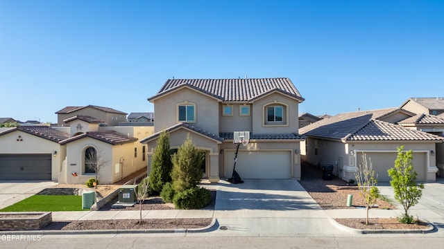 mediterranean / spanish-style home featuring a garage and central AC unit