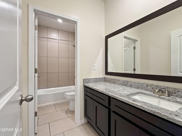 bathroom with shower / bath combination, vanity, toilet, and tile patterned floors