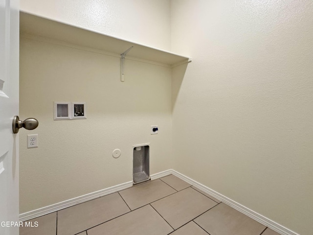 laundry room with hookup for a washing machine, light tile patterned flooring, hookup for an electric dryer, laundry area, and baseboards