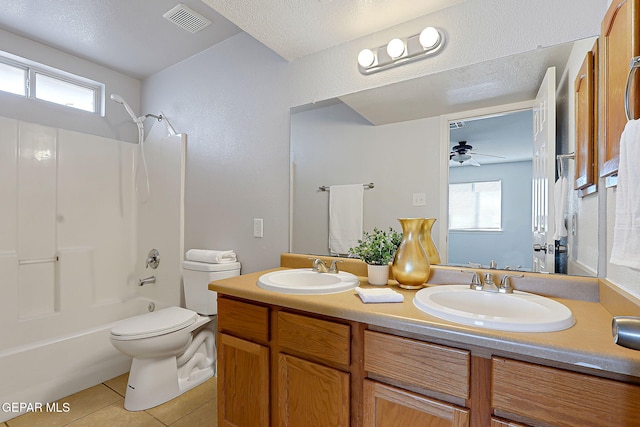 full bathroom with tile patterned flooring, visible vents, a sink, and shower / bathing tub combination