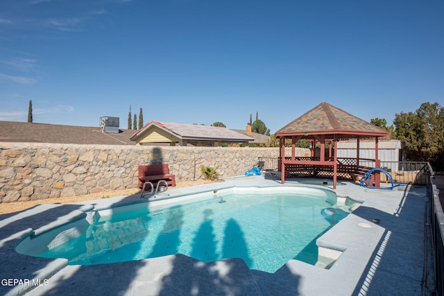 view of swimming pool with a gazebo, a fenced backyard, and a fenced in pool