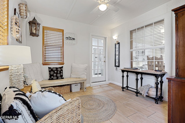 interior space with ceiling fan