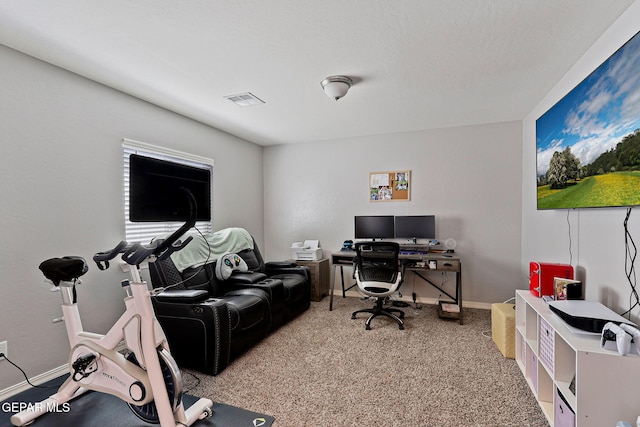office with baseboards, visible vents, and carpet