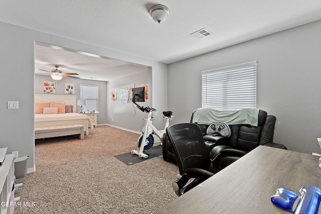 carpeted bedroom with visible vents and baseboards