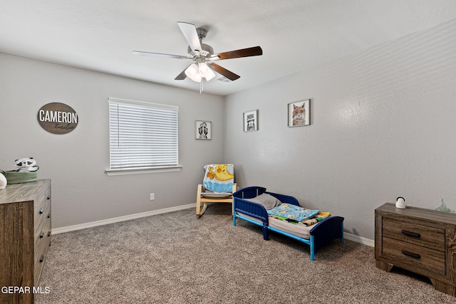 carpeted bedroom with baseboards and ceiling fan