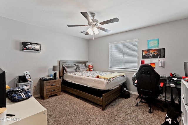 bedroom featuring visible vents, baseboards, a ceiling fan, and carpet flooring