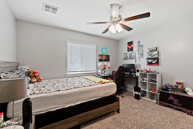 bedroom featuring a ceiling fan, carpet flooring, and visible vents
