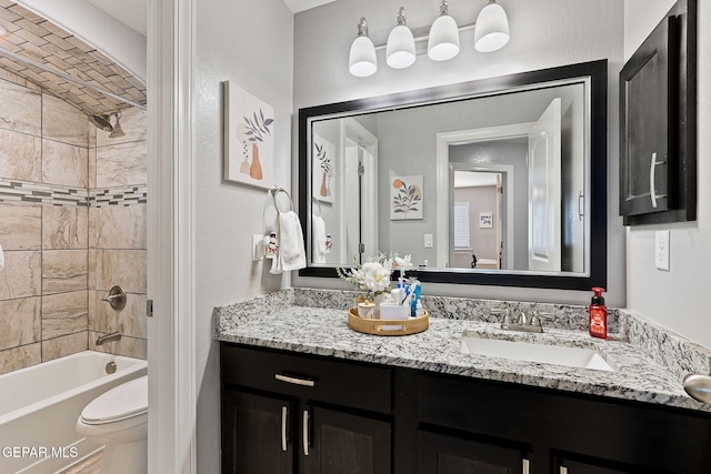 full bathroom featuring vanity, washtub / shower combination, and toilet