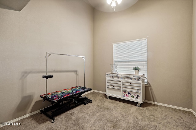 game room with light carpet and baseboards