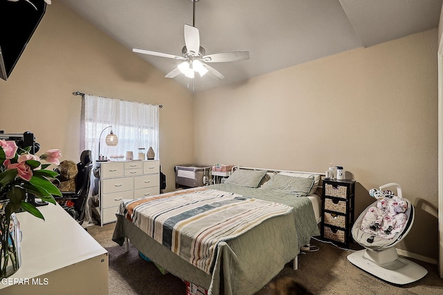 bedroom with dark colored carpet, ceiling fan, and lofted ceiling