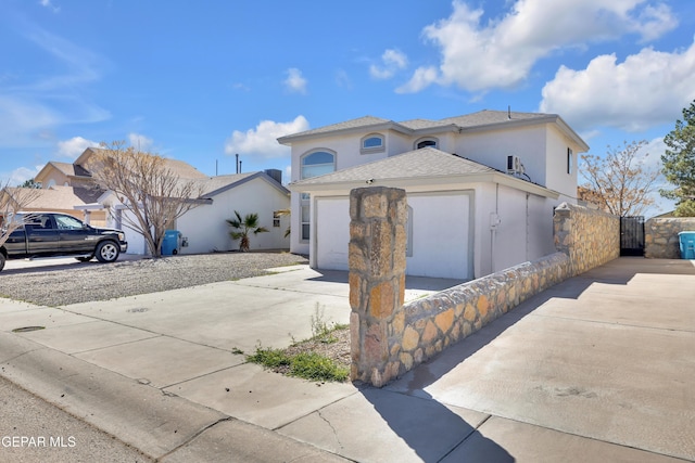 view of front facade featuring roof with shingles, stucco siding, concrete driveway, an attached garage, and fence