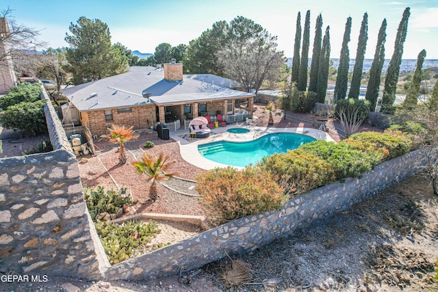 pool featuring a patio area