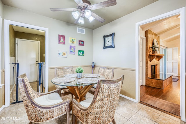 dining area with visible vents, ceiling fan, and light tile patterned floors