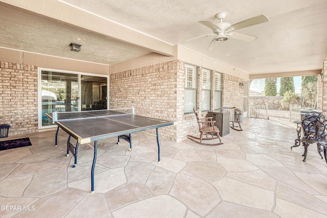 view of patio with outdoor dining space and ceiling fan