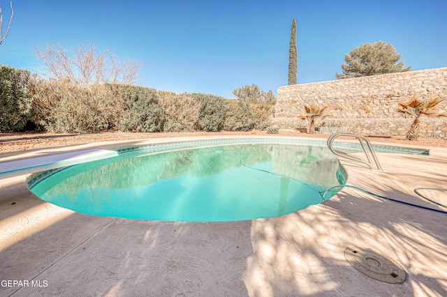 view of pool with a fenced in pool