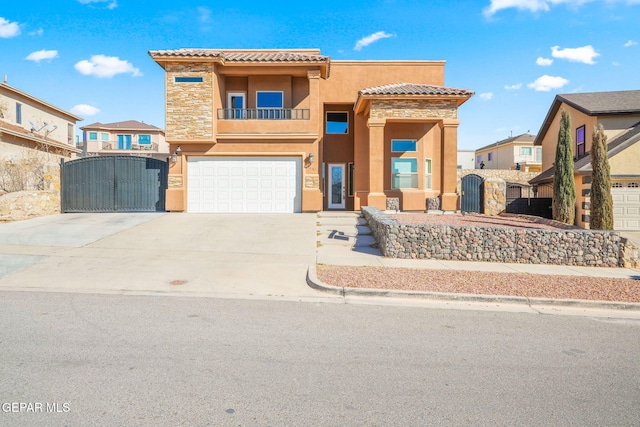 view of front of property featuring stucco siding, concrete driveway, a gate, a garage, and stone siding