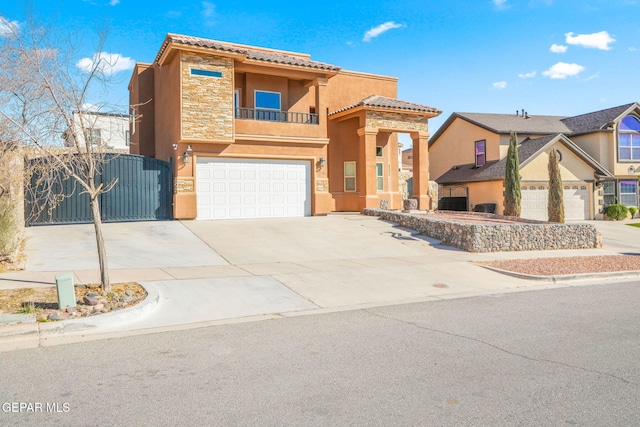 view of front facade featuring driveway, a garage, a balcony, stone siding, and stucco siding