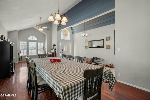 dining room featuring ceiling fan with notable chandelier, high vaulted ceiling, dark wood finished floors, and baseboards