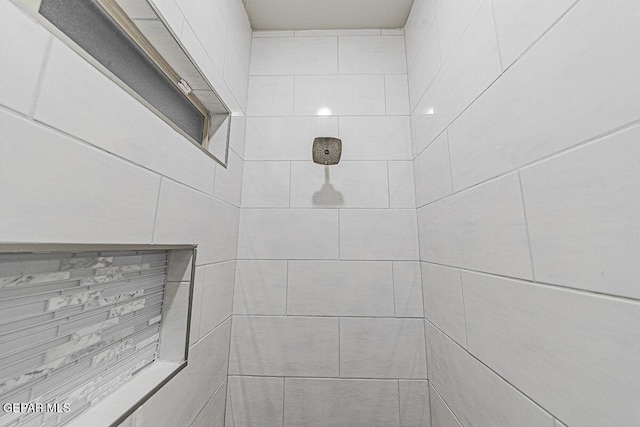 details with a tile shower