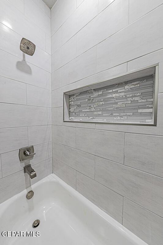 bathroom with shower / bathtub combination