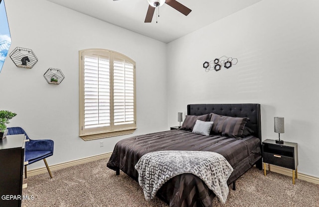 carpeted bedroom with a ceiling fan and baseboards