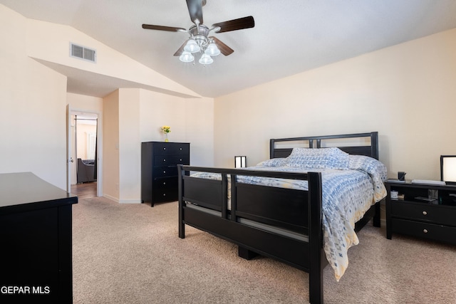 bedroom with baseboards, visible vents, a ceiling fan, light colored carpet, and vaulted ceiling