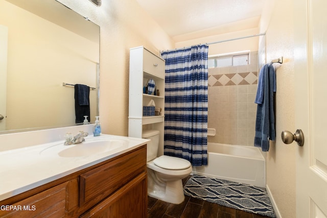 full bathroom featuring toilet, vanity, wood finished floors, and shower / bath combo with shower curtain