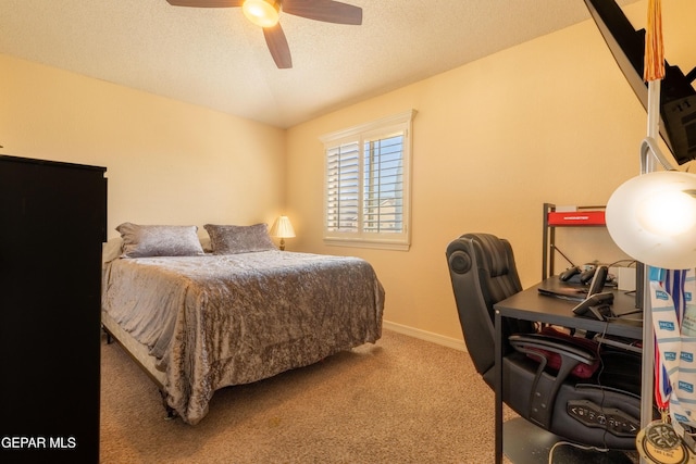 bedroom featuring carpet floors, ceiling fan, baseboards, and a textured ceiling