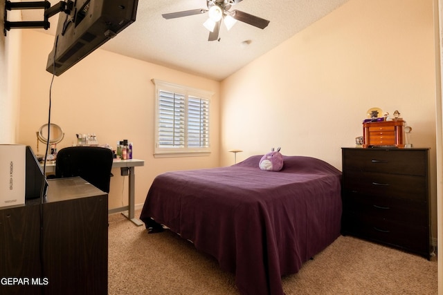 bedroom with lofted ceiling, light carpet, and ceiling fan